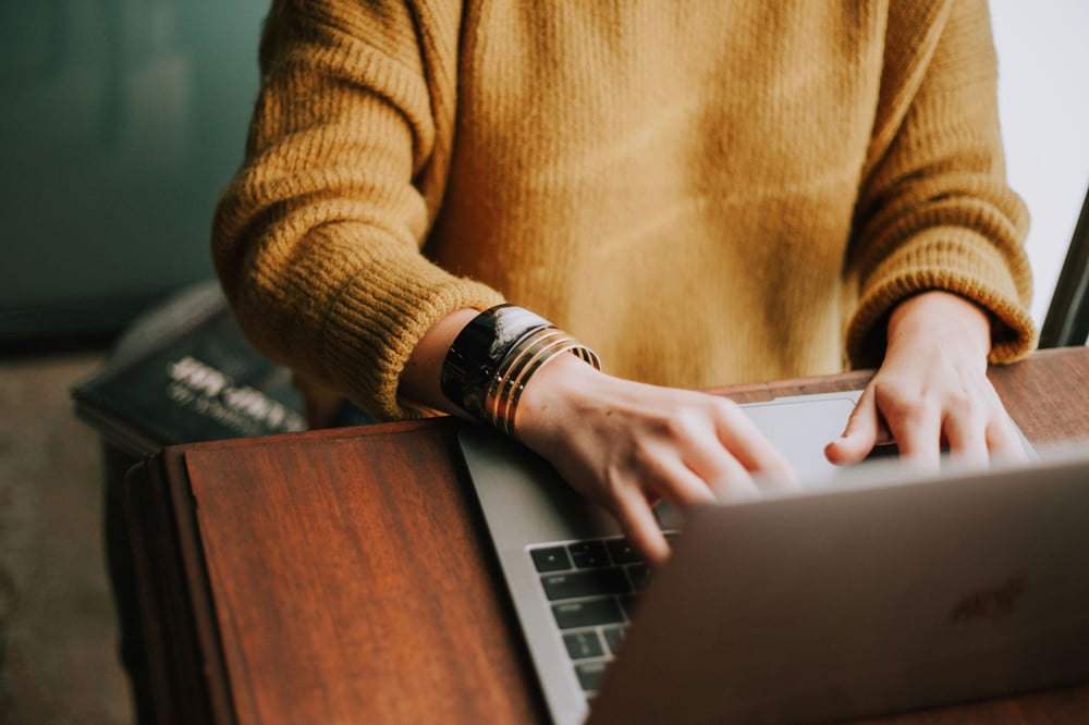 woman typing on computer